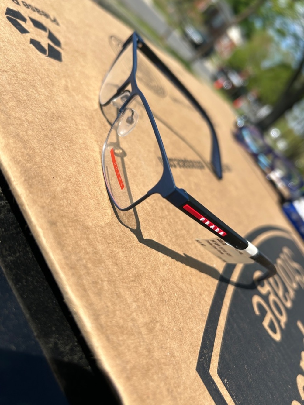 Prada Navy Frames with Red Logo Stripe